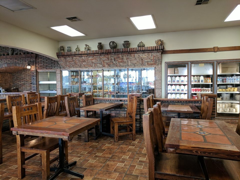 Mexican fast food spot with simple tables.