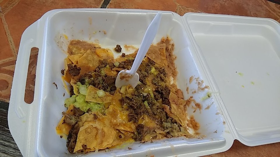 Printed menu with burritos and tacos.