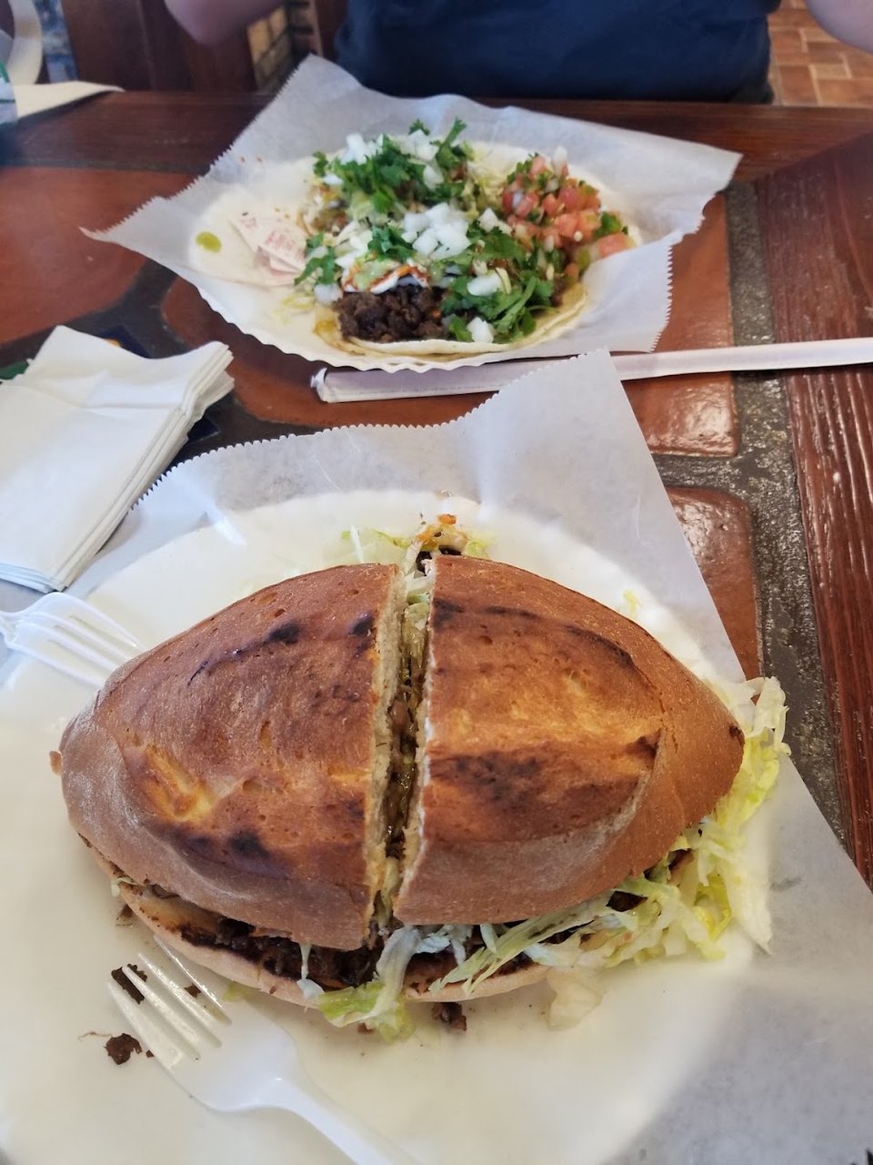 Simple menu listing tortas, sopes, and flan.
