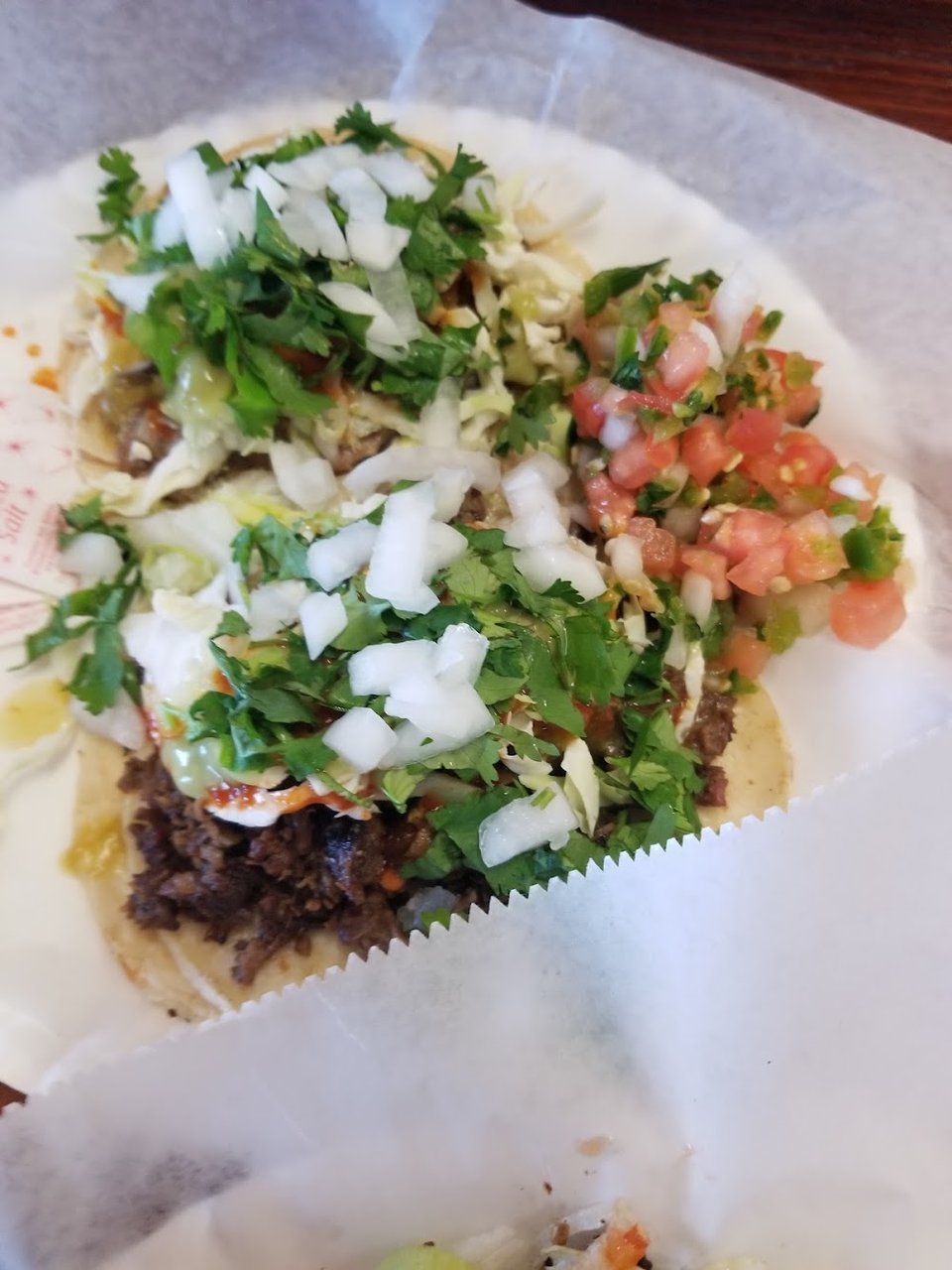 Printed menu with burritos and tacos.